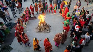 Women perform a traditional folk dance near a bonfire as they celebrate the Lohri festival, which marks the culmination of winter in many parts of northern India, in Jammu.