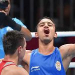 Amit Panghal gestures after defeating Uzbekistan Hasanboy Dusmatov during the Men's light fly boxing final bout