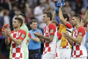 Croatia's Josip Pivaric, Mario Mandzukic and Marko Pjaca applaud after losing the final.