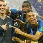 France's Antoine Griezmann, Paul Pogba and Kylian Mbappe celebrate after winning the World Cup.