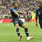 France's Kylian Mbappe, center, celebrates after scoring his side's fourth goal