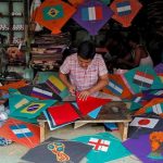 Kite-makers make kites with pictures of the national flags of the countries participating in the upcoming FIFA World Cup in Russia, at a workshop in Kolkata, India