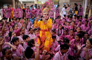 A student dressed up as Lord Krishna takes part in Janmashtami festival celebrations at a school, in Amritsar