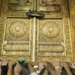 Pilgrims touch the golden door of the Kaaba, the cubic building at the Grand Mosque. For the Muslim faithful, Hajj retraces the last steps of the Prophet Mohammed and also honours the prophets Abraham and Ishmael.