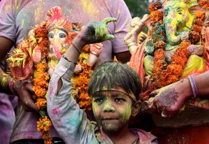 Devotees carry statues of Lord Ganesha for immersion at Ghaggar River in Panchkula, Haryana