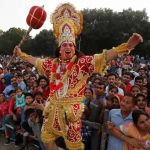 An artist dressed as Hanuman participates in Vijaya Dashmi, or Dussehra festival celebrations in Chandigarh