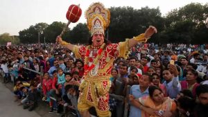 An artist dressed as Hanuman participates in Vijaya Dashmi, or Dussehra festival celebrations in Chandigarh