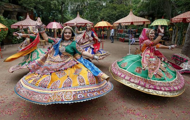 Participants, dressed in traditional attire, take part in a Garba dance rehearsal for the forthcoming Navratri festival, in Ahmedabad on September 22, 2019.