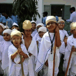 Students dressed as Mahatma Gandhi take part in an event to mark Gandhis 150th birth anniversary at a school in Ahmedabad