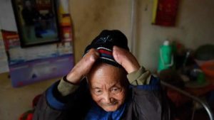 Leprosy patient Nguyen Quang Chieu, 85, wears his wool cap. There were 248 people being treated for leprosy in 2017 in Vietnam, down by more than half from a decade earlier, according to data from the World Health Organization. But as numbers have decreased so have the live-in patients at the Van Mon centre.