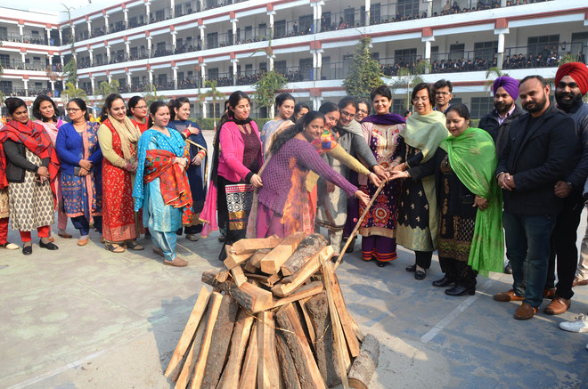 Students and teachers of Police DAV School perform a cultural programme during celebrated Lohri in school campus Jalandhar Cantt