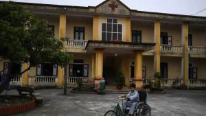 A young Vietnamese boy rides a tricycle for a leprosy patient at the Van Mon Leprosy hospice. “There were about 2,000 people here then, mostly young people. It was fun because we started a teen union,” the 80-year-old told AFP, sitting on his bed with his wife Teo of 54 years.