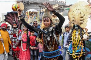 An artist dressed as Hindu deity Shiva performs a dance during a religious procession on the occasion of Maha Shivaratri festival, in Amritsar