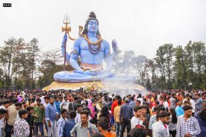 Devotees offer prayers near a statue of Lord Shiva on the occasion of ‘Maha Shivratri’ in Jabalpur