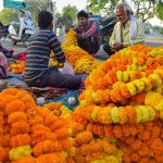 People buy flowers for rituals on the occasion of Ram Navami during a nationwide lockdown in the wake of coronavirus pandemic, in Prayagraj on April 2, 2020