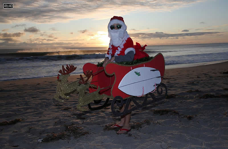 A young Santa Claus is seen during the 10th Annual Surfing Santa’s event in Cocoa Beach, Florida in US on December 24, 2019.