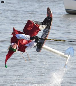 One of Santa’s ‘elves’ performs on water during an annual Christmas Eve appearance on the Potomac River along the Alexandria, Virginia waterfront in US on December 24, 2019.