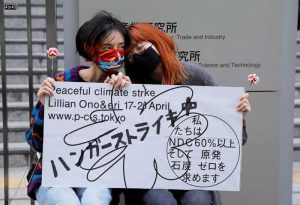 Young climate activists Lilian Ono and Eri hold a hunger strike to mark the World Earth Day in Tokyo, Japan.