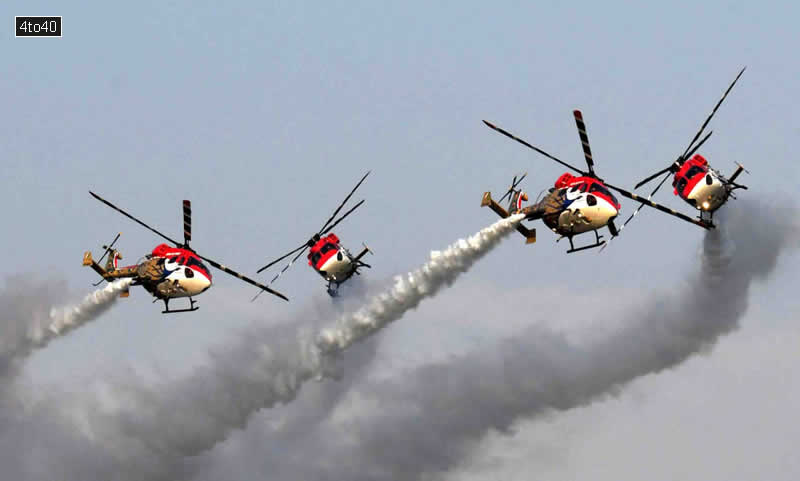 Indian Air Force Sarang helicopters fly during Air Force Day parade at the at Sukhna Lake, Chandigarh