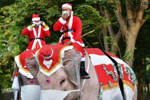 Santa Claus gave his sleigh and reindeer a break and rode elephants in Thailand during a special Christmas visit aimed at raising awareness about the threat of the Corona Virus
