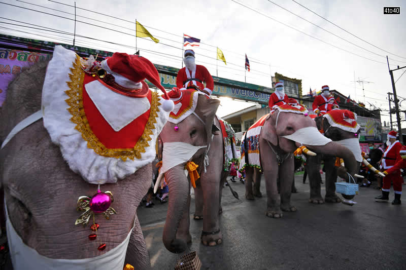 Santa Claus gave his sleigh and reindeer a break and rode elephants in Thailand during a special Christmas visit aimed at raising awareness about the threat of the Corona Virus