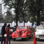 Visitors check out vintage cars at the 51st Rose Festival in Chandigarh on 17/02/2023