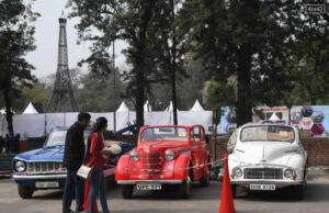 Visitors check out vintage cars at the 51st Rose Festival in Chandigarh on 17/02/2023