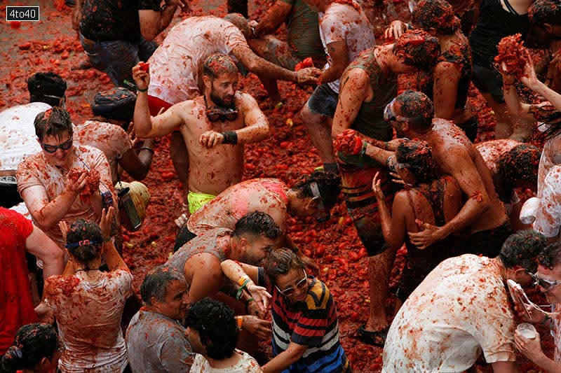 Crowds battled through the streets of Bunol, Spain armed with tomatoes
