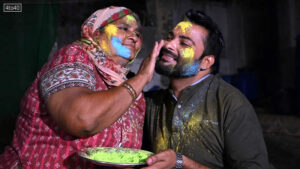 A mother paints the face of her son as they celebrate Hindu festival of Holi in Tharparkar district of the desert town of Mithi, south-eastern Pakistan