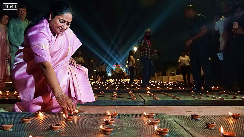 Rekha Gupta lights an earthen lamp during Deep Mahotsav celebrations