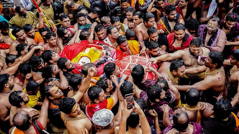 Devotees carry Goddess Subhadra to the Darpadalana Ratha during Mahaprabhu Jagannath Rath Yatra