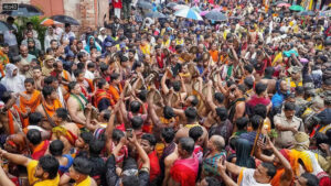 Devotees play traditional Odia gong (Ghanta) during the Mahaprabhu Jagannath Rath Yatra