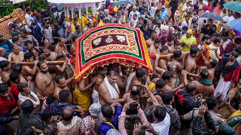 Priests and servitors take out a procession as the annual Jagannath Rath Yatra commences