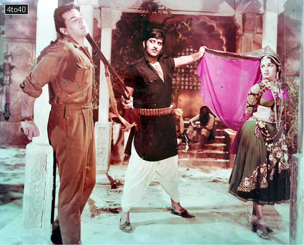 Vinod Khanna, Asha Parekh and Dharmendra in a scene from the film 'Mera Gaon Mera Desh'.